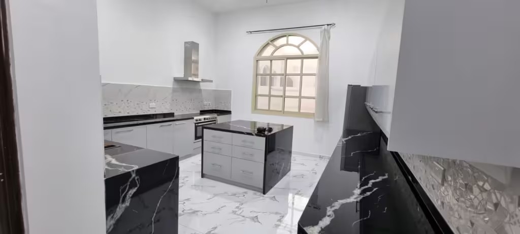 Complete room renovation – fully functioning kitchen with black and white design